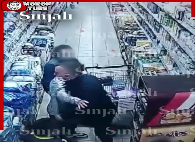 Video :An angry guy at a store strikes a woman without cause